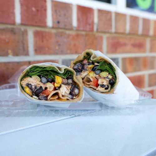 Southwest wrap on table against brick wall
